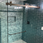 shower glass door teal tiles